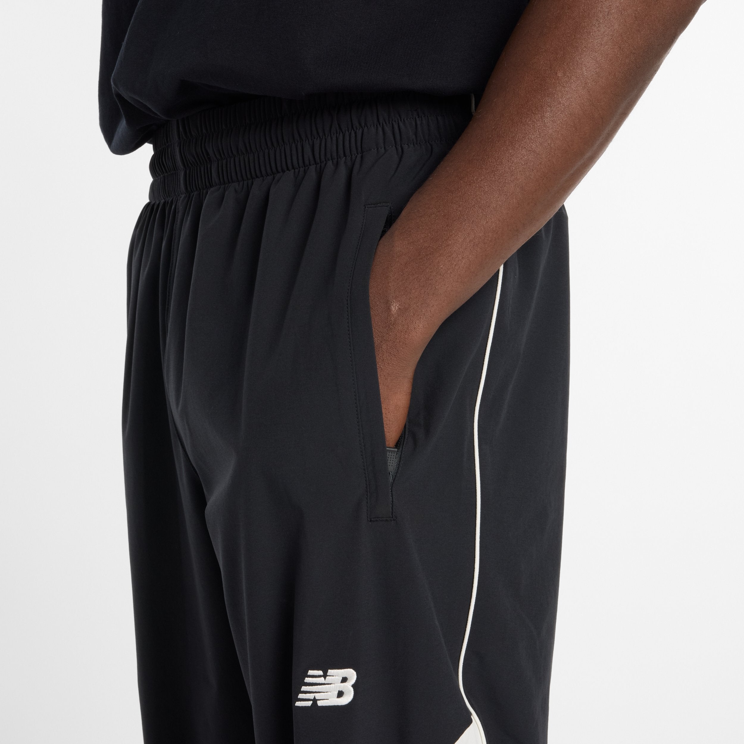 NEW BALANCE IN GAME WOVEN TRACK PANT