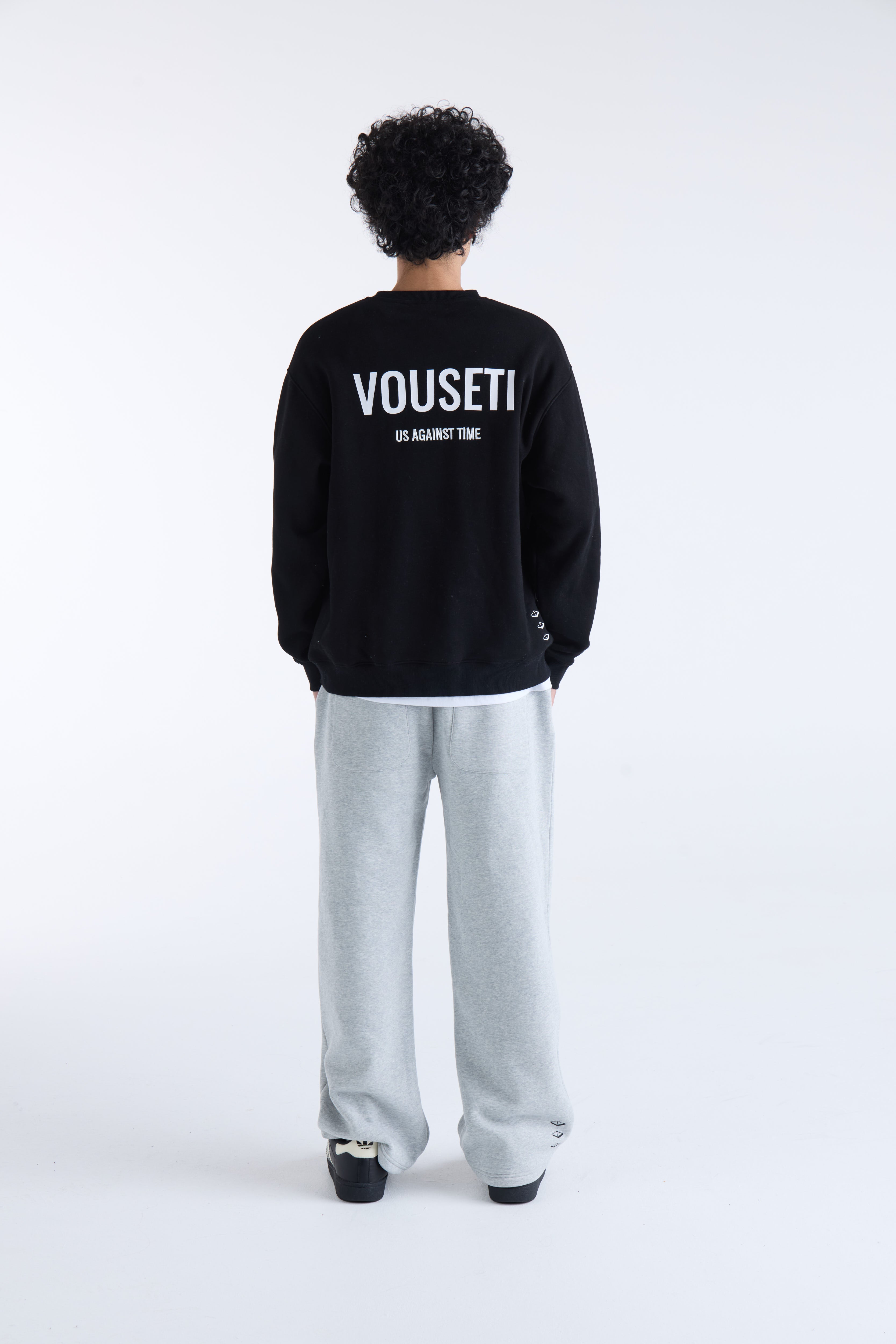 VOUSETI US AGAINST TIME SWEATER