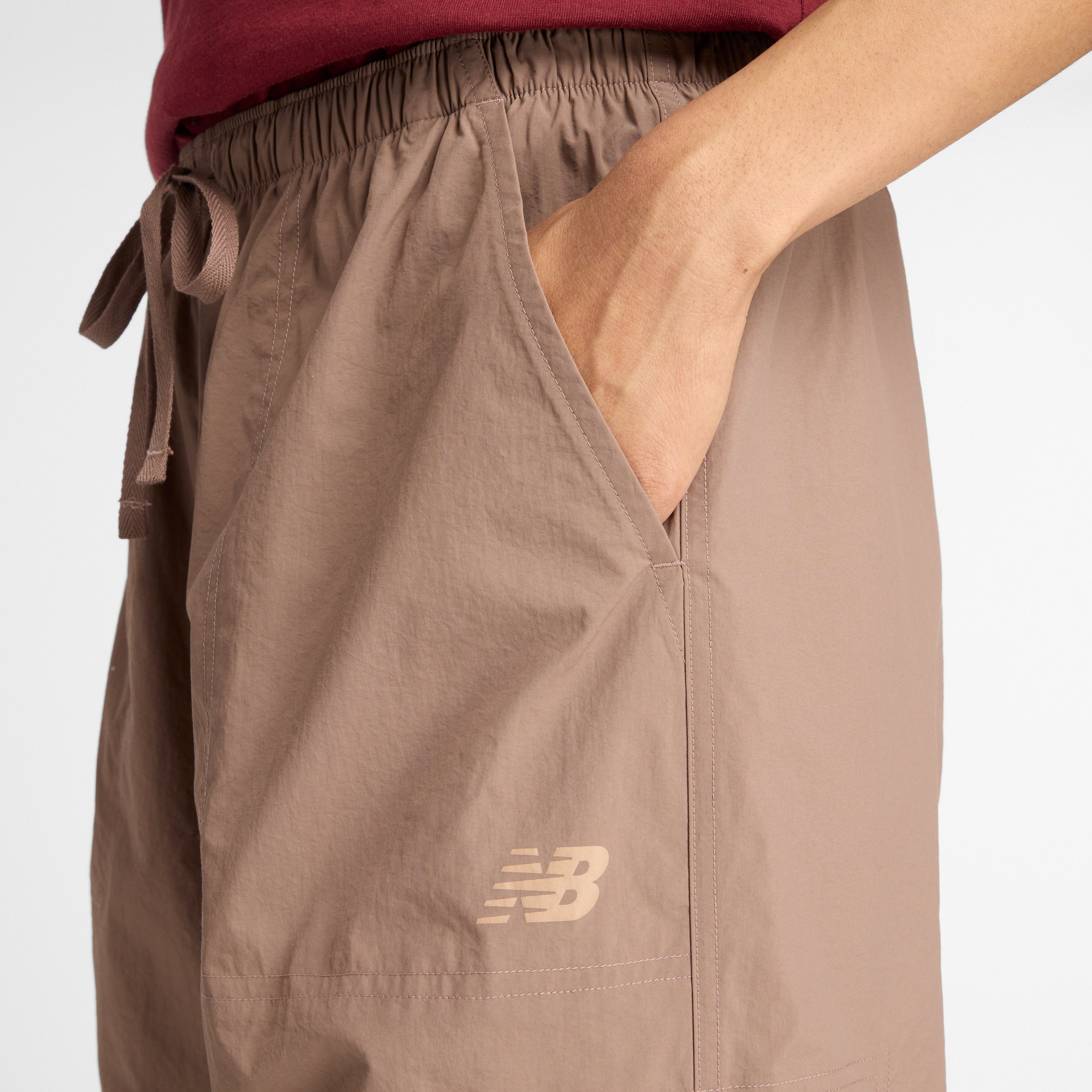 NEW BALANCE WOVEN CARGO PANT-EAS