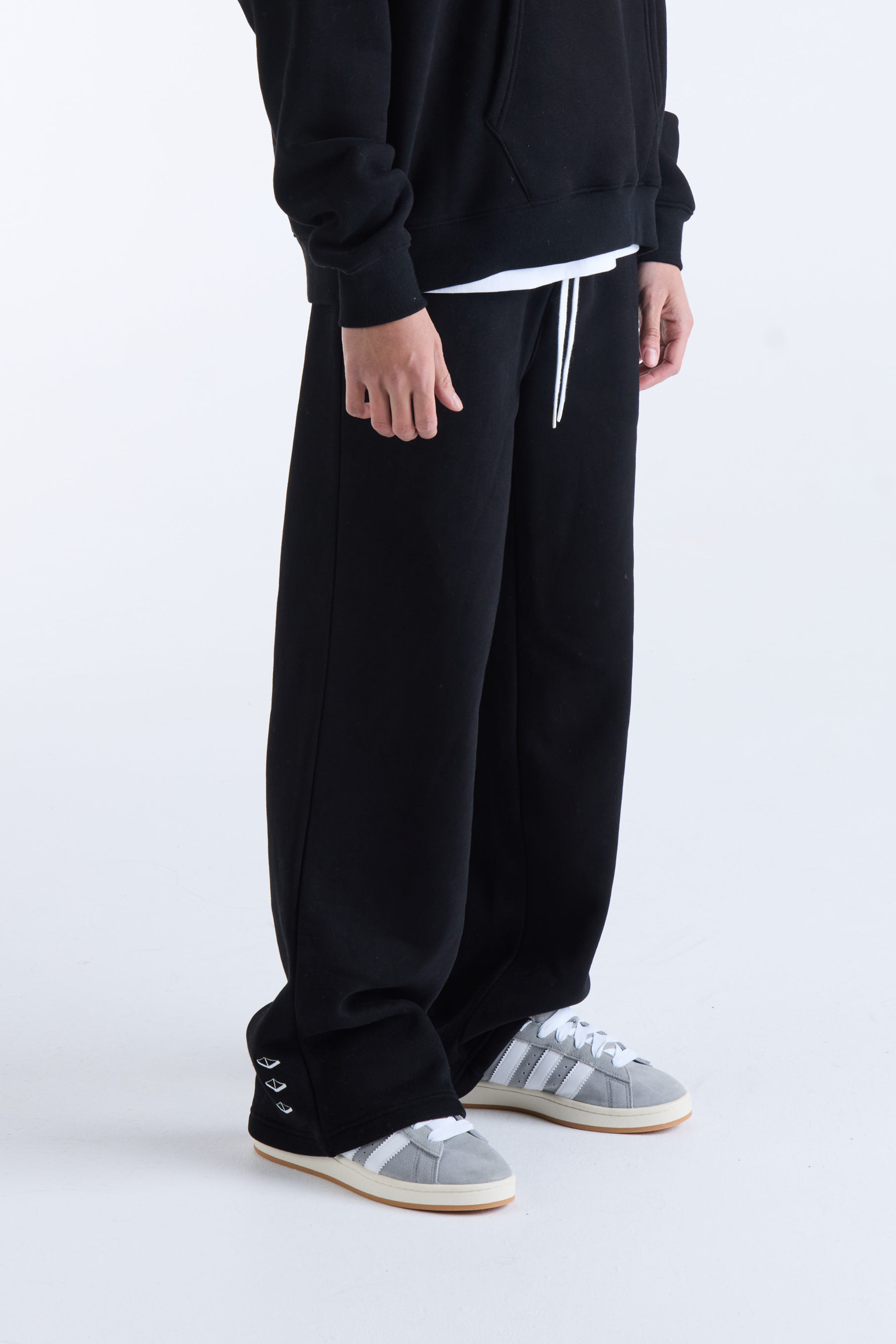 VOUSETI US AGAINST TIME TRACKPANTS