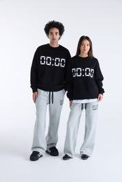VOUSETI US AGAINST TIME SWEATER